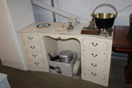 An ornate painted twin pedestal dressing table fit