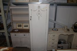 An ornate decorated single door wardrobe