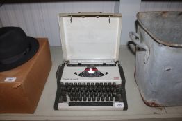 An Olympia AEG typewriter and case