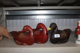 Three wooden storage boxes in the form of ducks