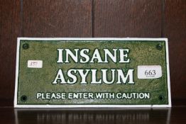 A reproduction novelty sign 'Insane asylum' (137)