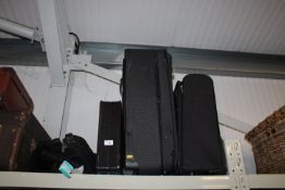 Two suitcases and two travel cases