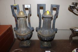 A pair of heavy gilded metal twin handled urn lamp