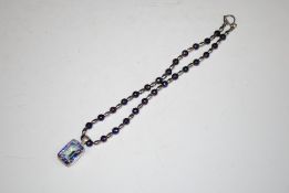A 925 silver mounted polished stone pendant hung t