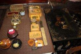 A collection of various wooden items to include Mauchline ware, an Eastern Telegraph Company page