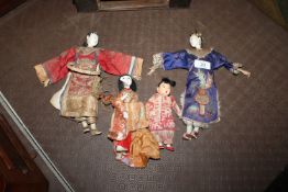 Four various dressed Chinese opera dolls