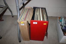 A case and a box of various vinyl LP's