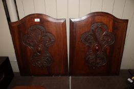 A pair of 19th Century carved mahogany panels