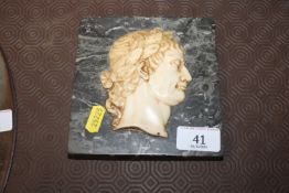 A marble relief plaque of an emperor