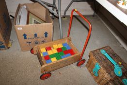 A vintage Tri-ang baby walker