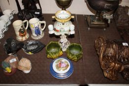 A Burleigh Ware puzzle jug; continental porcelain candelabra; two Bretby type posy holders and a