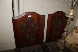 A pair of 19th Century carved mahogany panels
