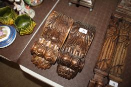 A pair of carved and gilded scrolled corbels