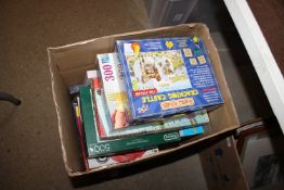 A box of various puzzles etc.
