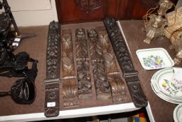 A pair of carved oak columns with lion mask and fr