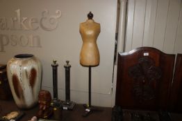 A vintage child's tailors dummy