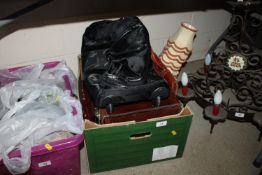 A box containing various briefcases etc.