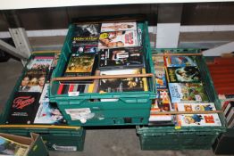 Three boxes containing various DVD's