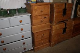 A pair of pine bedside chests fitted two drawers