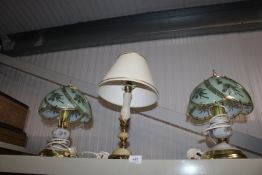 A pair of table lamps having floral decorated shad