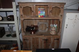 A rustic pine dresser raised on cupboard base approx. 199.5 cm high x 137 cm wide (dresser comes