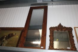 An oak framed wall mirror