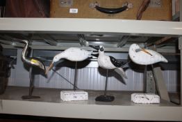 Three wooden ornaments in the form of birds, toget