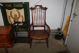 A Victorian mahogany cane seated arm chair
