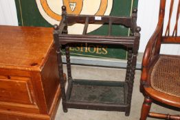 A wooden and metal stick stand