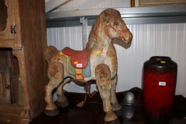 A Mobo Bronco painted metal ride on horse
