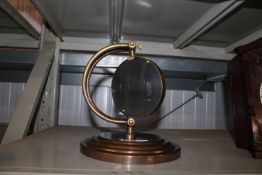A reproduction tabletop magnifying glass (42)