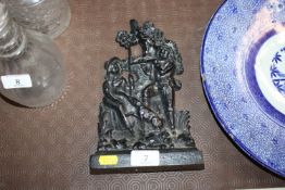 A cast iron figural decorated doorstop