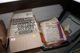 A box and a case containing various old newspapers