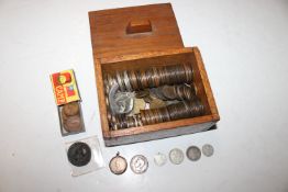 A wooden box and contents of various coinage to in