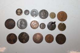 A tin of various coinage to include a brass guinea, various silver coinage, Royal commemorative