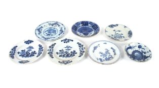 Six various 18th Century Delft plates, mostly AF; a Delft shallow dish decorated in the Chinese