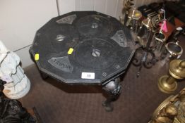A cast iron con tripod stand / hotplate