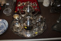A silver plated four piece tea set on tray and a s