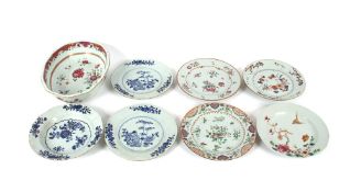 A pair of 19th century Chinese plates decorated with bamboo shoots and floral sprays, a similar