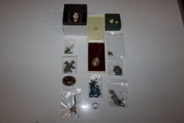 A box of various costume jewellery to include necklaces and pendants, a dress ring, a pair of
