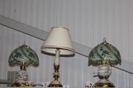 A pair of table lamps and an onyx style table lamp