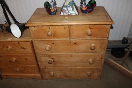 A stripped pine chest fitted two short over three