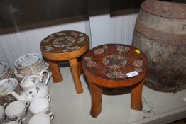 Two wooden ethnic stools with bead decoration seat
