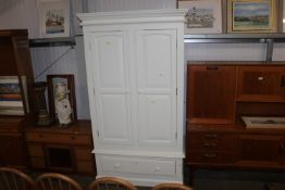 A modern white two door wardrobe, fitted single dr