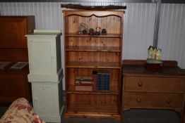 A pine open fronted bookcase with adjustable shelv
