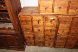 A hardwood storage unit fitted 12 drawers