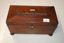 A 19th Century mahogany sarcophagus shaped tea cad