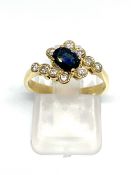 Sapphire and diamond cross-over ring, stamped 750, overall weight 3.