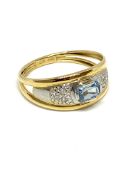Blue topaz and diamond white and yellow band stamped 750, total weight 2.