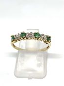 Emerald and diamond half hoop ring stamped 10K, overall weight 1.